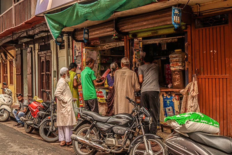 Shoppers outside an old market-street store